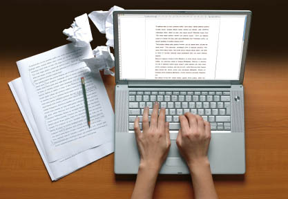 Editing a medical manuscript on a laptop with notes and revisions