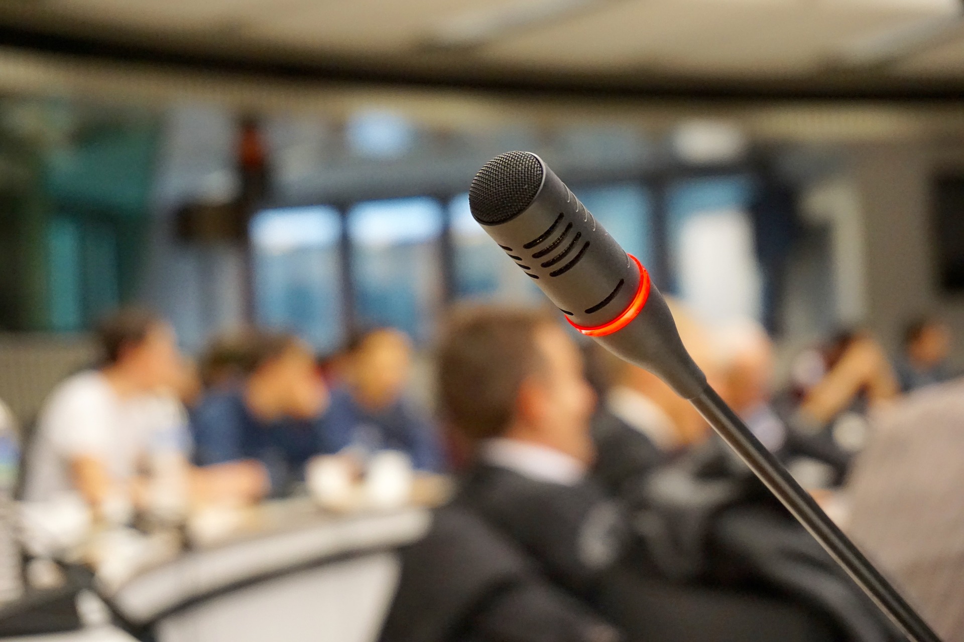 Microphone in focus at a seminar for clinical trial design